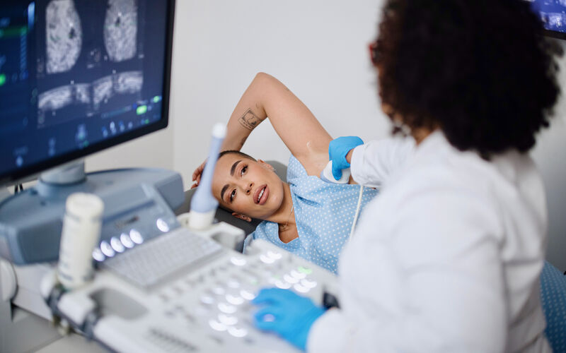 Woman undergoing breast ultrasound 
