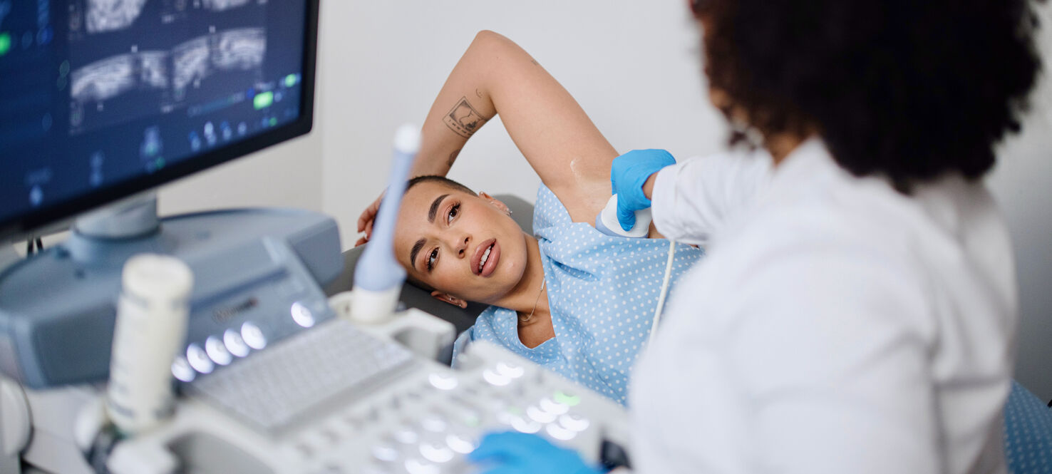 Woman undergoing breast ultrasound 