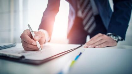 Business man signing contract