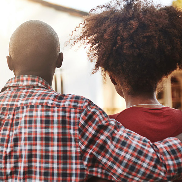  A couple standing in front of a home