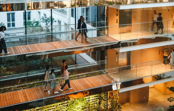Professionals navigating a multi-level office