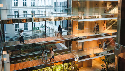 Professionals navigating a multi-level office