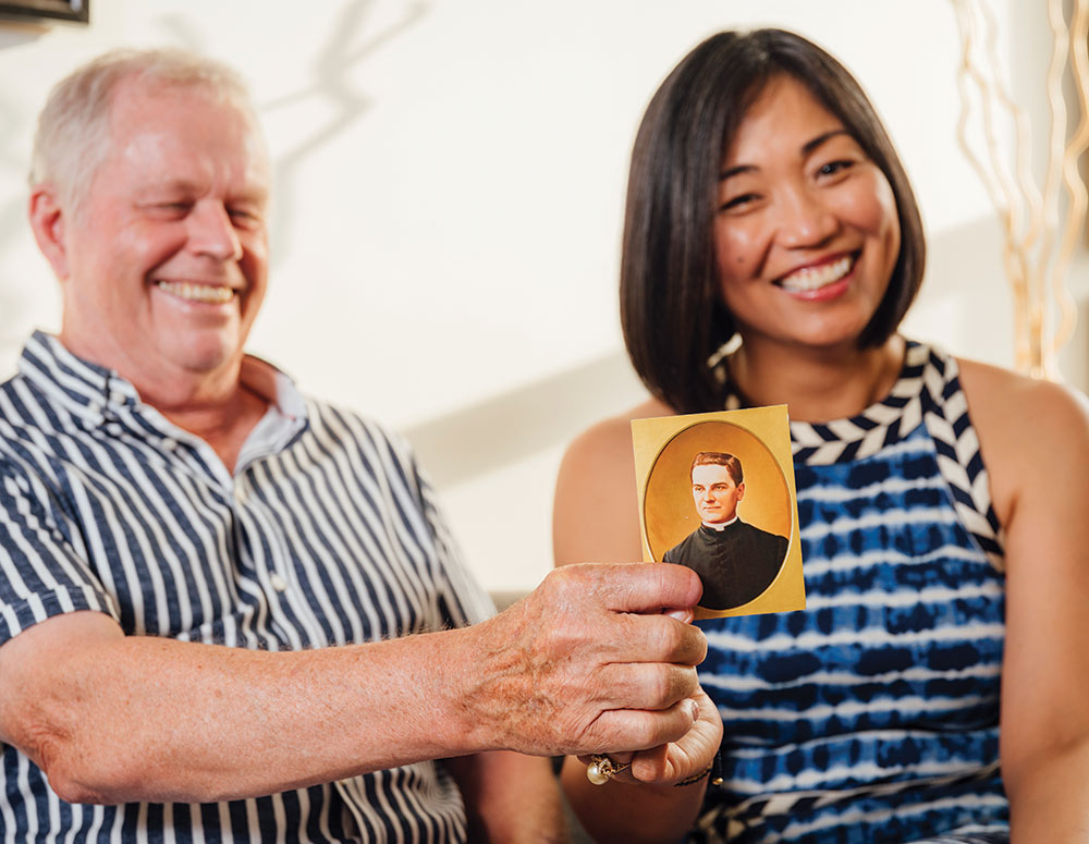 Donald and Johanna Ireland hold the prayer card that prompted Johanna to ask Father McGivney&rsquo;s intercession
