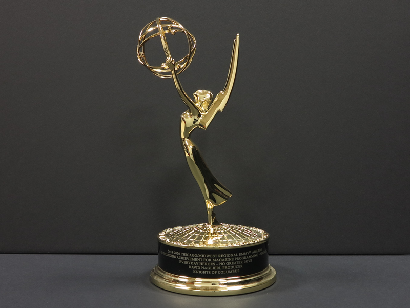 Emmy Award for Everyday Heroes episode "No Greater Love." Statuette of a winged woman holding an atom on a circular platform.