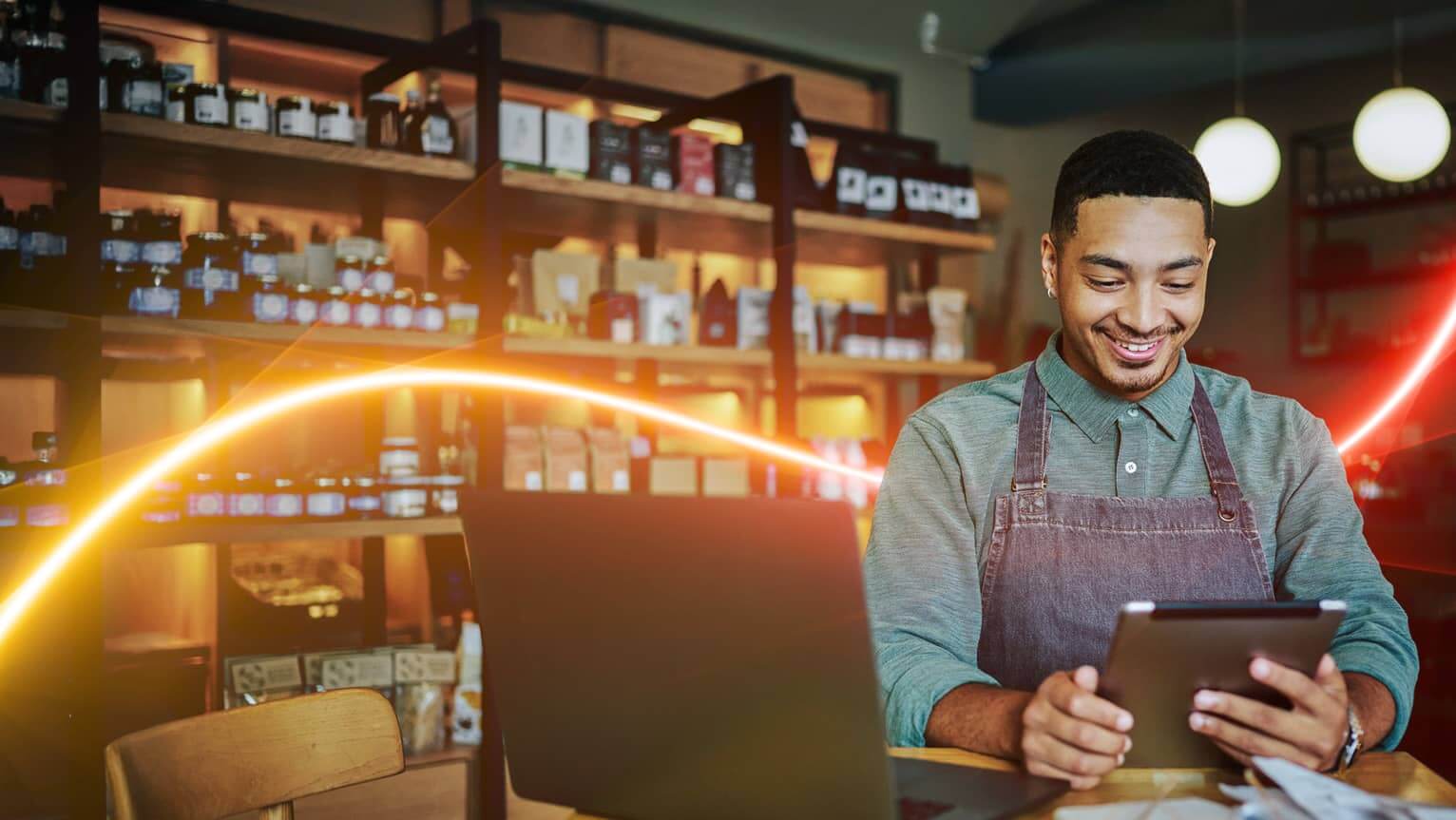 Image of a clerk holding an electronic tablet.
