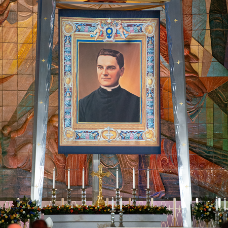 Altar at Cathedral of Saint Joseph with a large banner above of the Chas Fagan painting of Father McGivney.