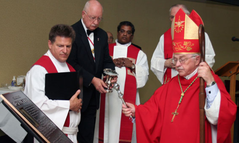 Bishop Frederick is blessing the Father McGivney Hall at St. Mary’s University Canada on July 2011.