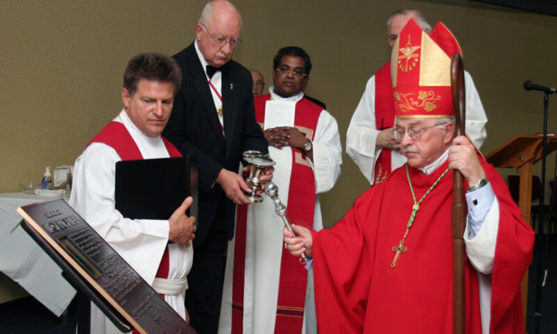Bishop Frederick is blessing the Father McGivney Hall at St. Mary’s University Canada on July 2011.