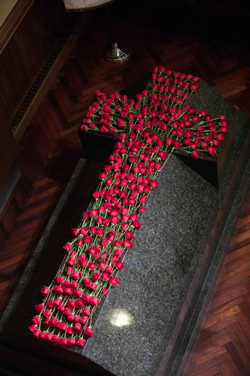 Father McGivney’s sarcophagus covered with roses