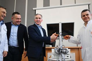 Supreme Knight Patrick Kelly and Dr. Fedir Yurochko cut the ribbon on a donated endoscopic device during the supreme knight’s visit to Okhmatdyt Children’s Hospital in Lviv