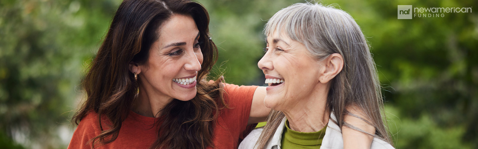 mother and daughter smiling and hugging each other