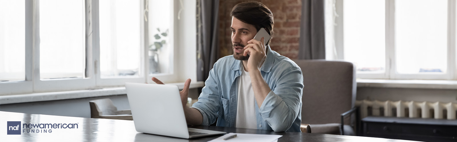 man on phone with laptop