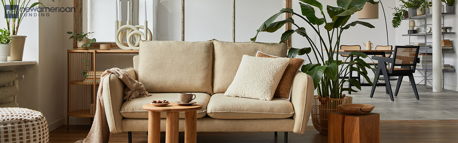 A cozy tan couch sits in a living room 