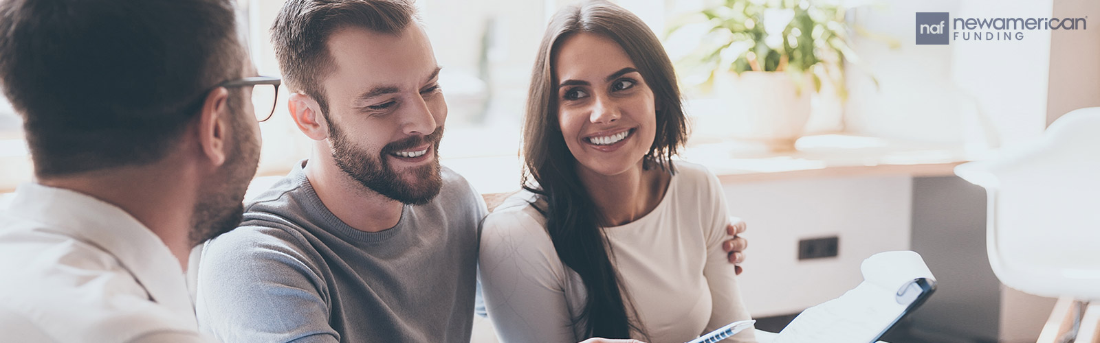 agent going over paperwork with homebuyers