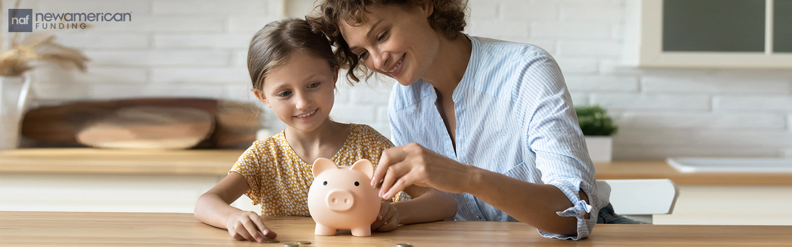 mother and daughter putting coins into a piggy bank