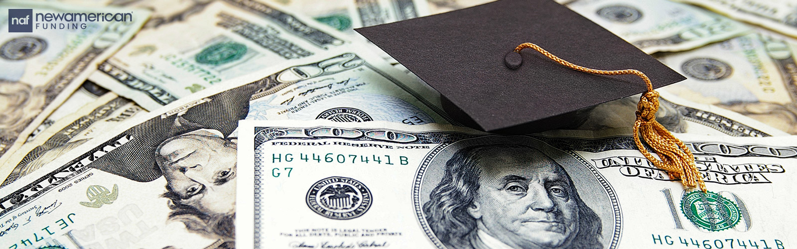 graduation cap laying on top of cash