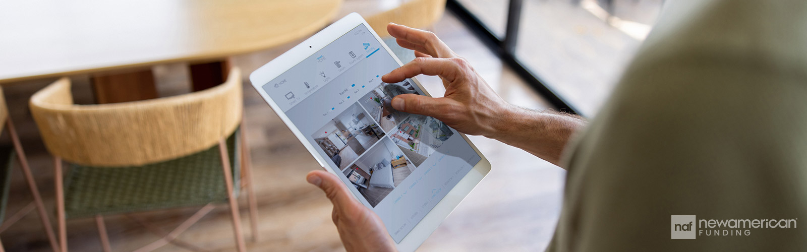 woman looking at security feed on a tablet