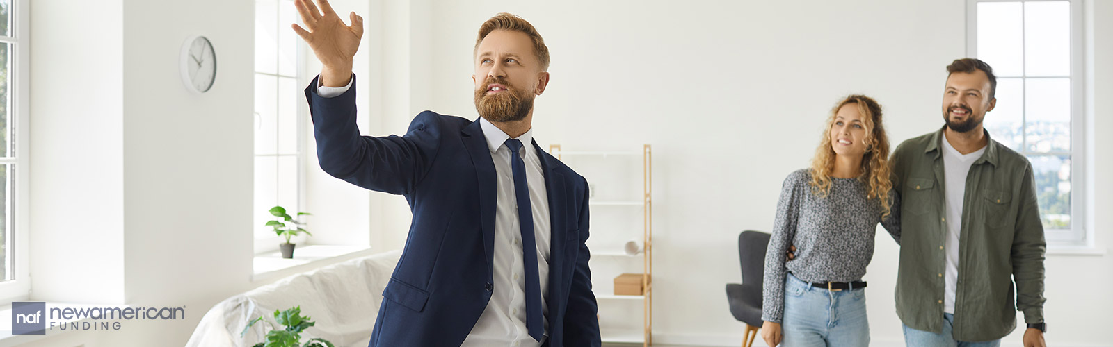 real estate agent showing a house to homebuyers