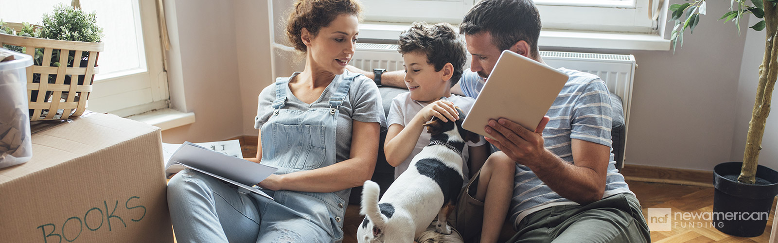 family sitting on the floor with their dog