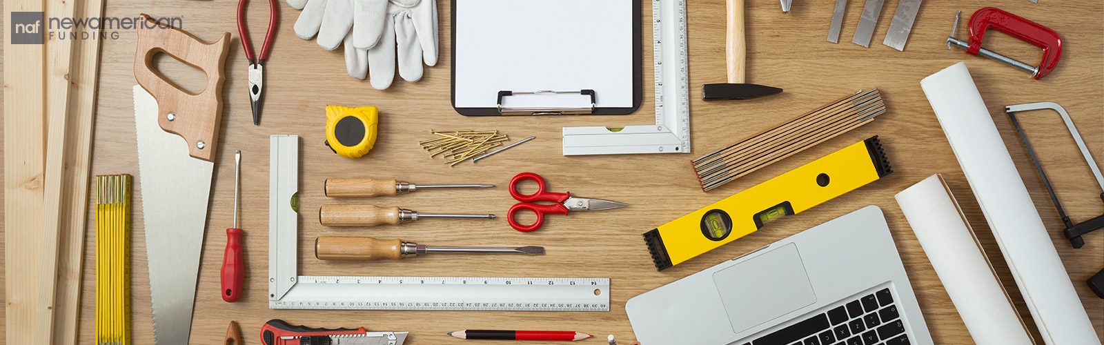 Various home improvement tools laid out on a desk top