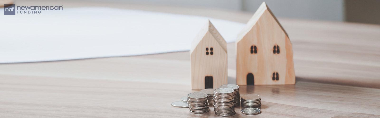 house models and stacks of coins