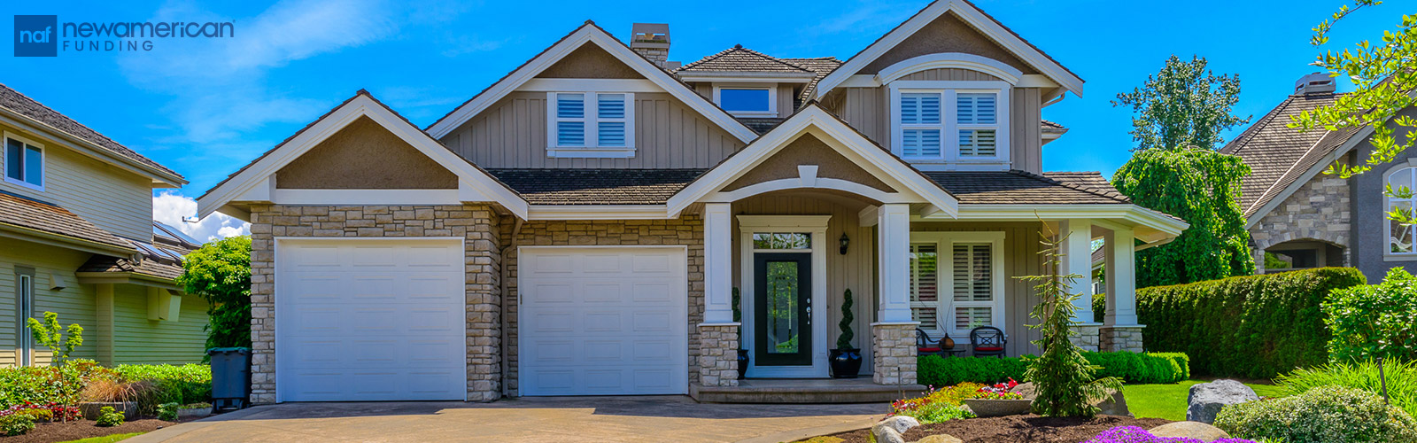 A beige two-story house built of stone