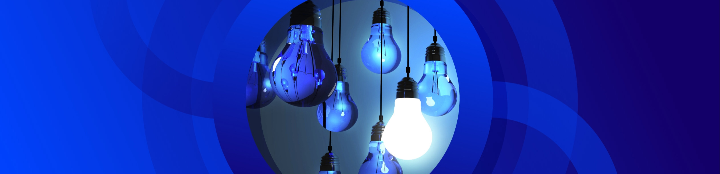 A digital image featuring several hanging light bulbs against a dark blue, circular background with lighter and darker blue concentric layers. Most of the light bulbs are a deep blue, suggesting they are off, but one bulb in the foreground, slightly below the center, is brightly illuminated with a glowing white light