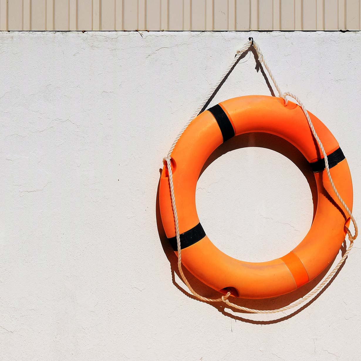 Three red darts perfectly hitting the bullseye on a dartboard