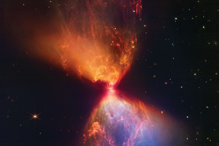 A protostar forms at the center of a blazing hourglass of interstellar gas and dust, captured by Webb’s Near Infrared Camera.