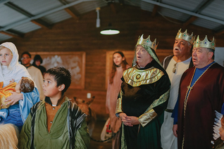 Knights and family members representing the Holy Family and the Magi sing Christmas carols during a Posada celebration at a homeless encampment in Austin, Texas. Deacons Tim Daheim, Juan de Dios Villarreal and Jesus Guerra (left to right) played the role of the Three Wise Men.