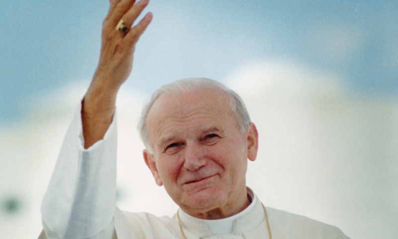 Pope John Paul II waves after arriving in Miami for his 1987 visit to United States