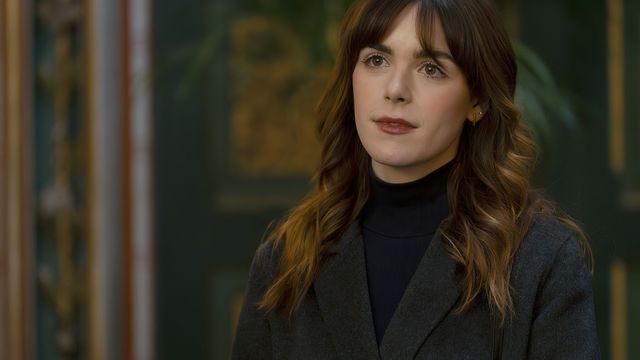 Kiernan Shipka as Haley Clay wearing a dark turtleneck and blazer