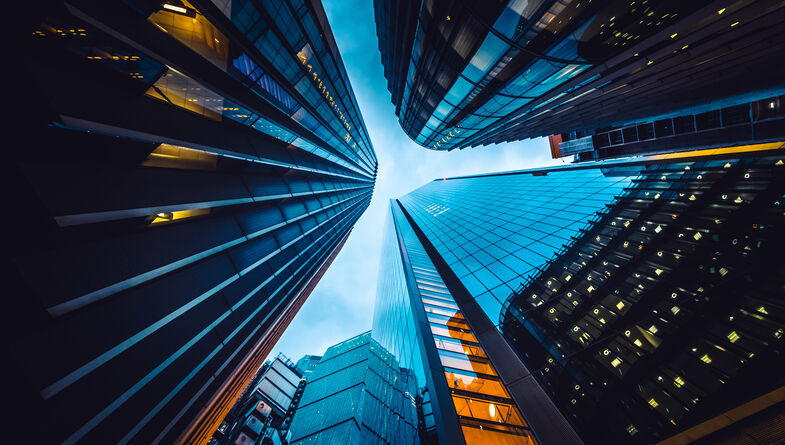 Looking directly up at the skyline at the financial district in London