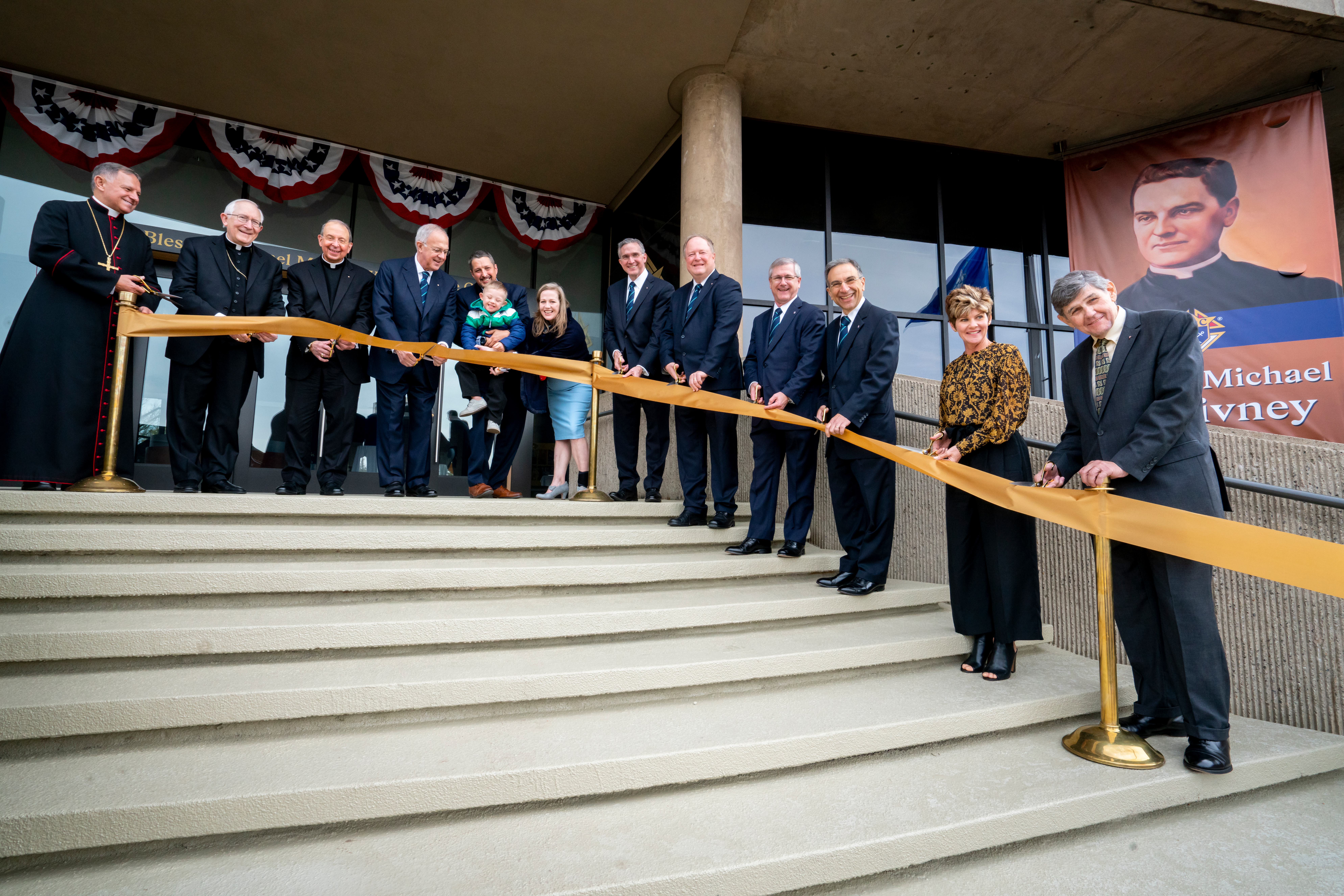 Knights of Columbus leaders and guests cut the ribbon outside the new pilgrimage center dedicated to Blessed Michael McGivney on November 1, 2020.