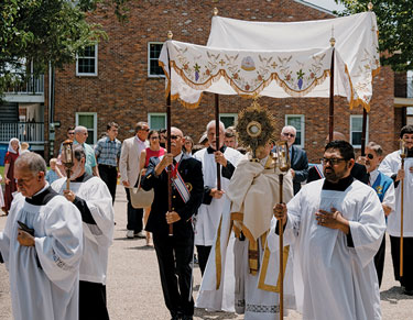 Members of New Roads (La.) Council 1998 help lead a eucharistic procession.