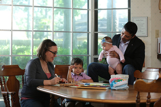 James Cueva and his wife Whitney, spend time with their two young children in their Houston home