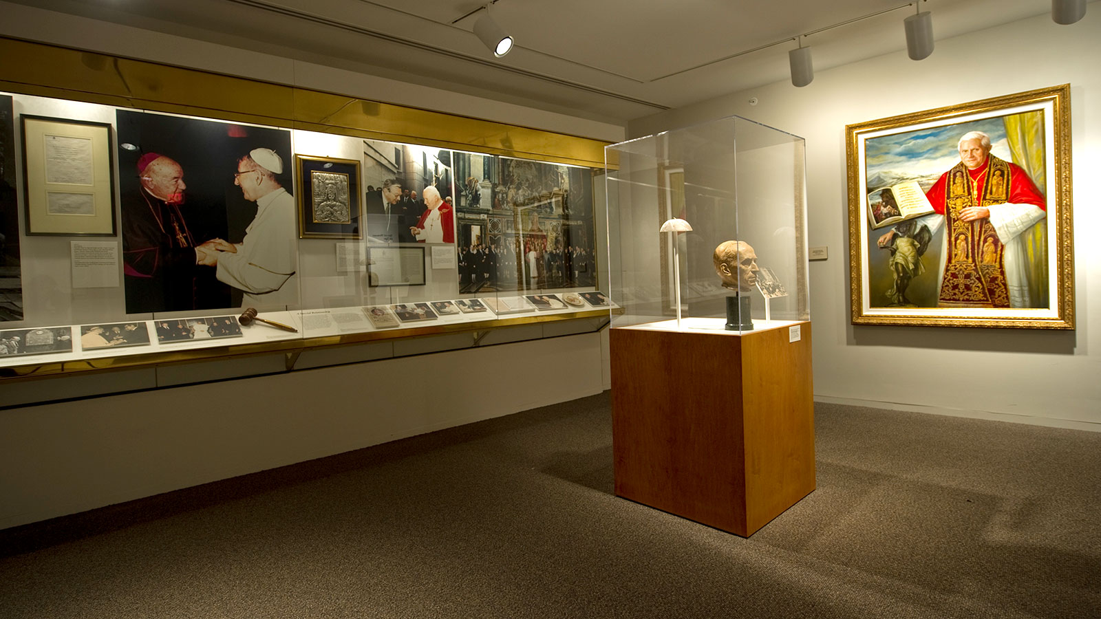 Photo of the Papal Gallery looking toward a portrait of Pope Benedict XVI by Antonella Cappuccio.