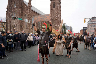 Members of Cathedral of St. John the Baptist Council 17254 in Paterson, N.J., participate in the council’s annual Via Crucis procession through downtown Paterson. (Photo by Greg Shemitz)