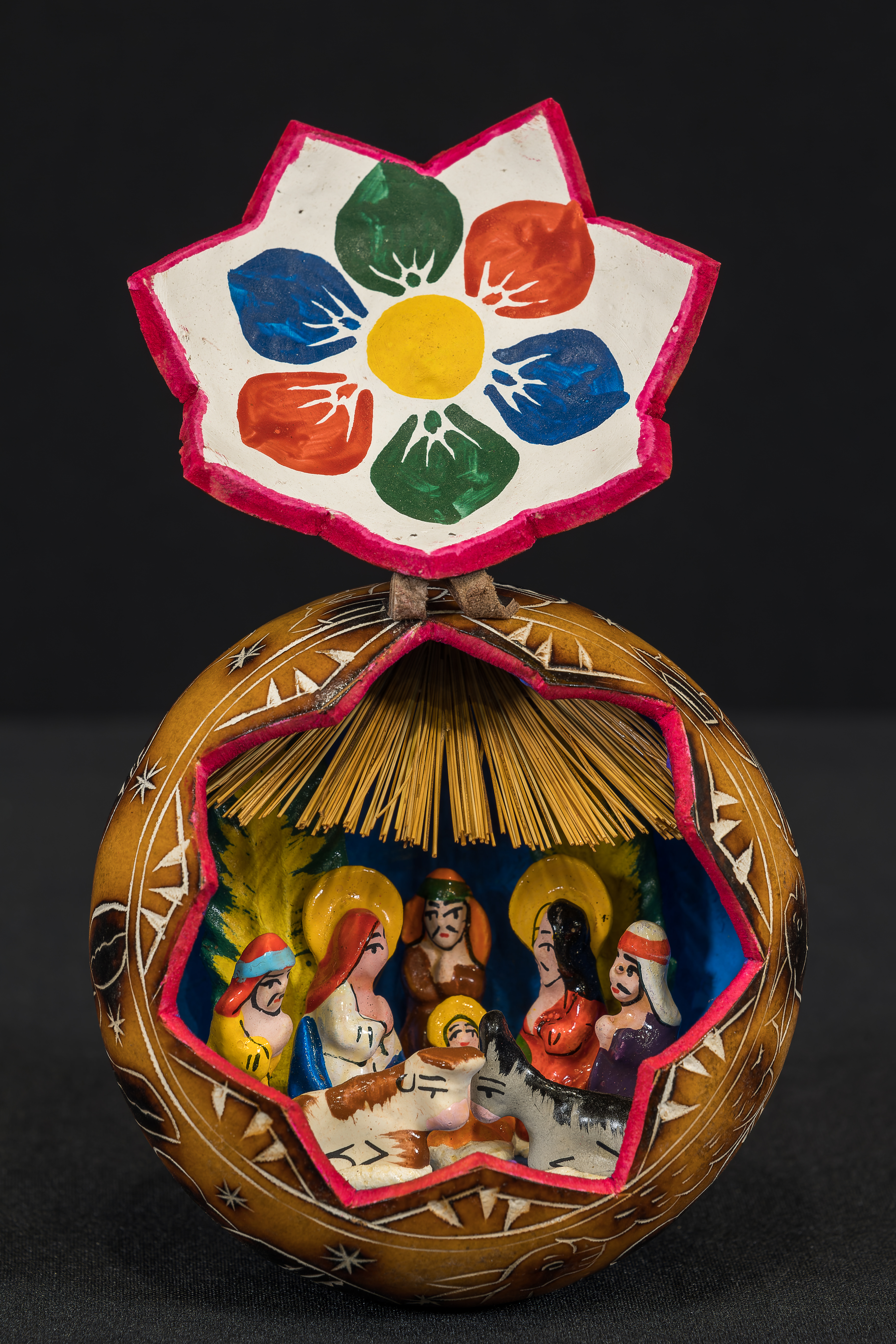 Crèche from Peru. Hollowed out gourd contains the Nativity scene.