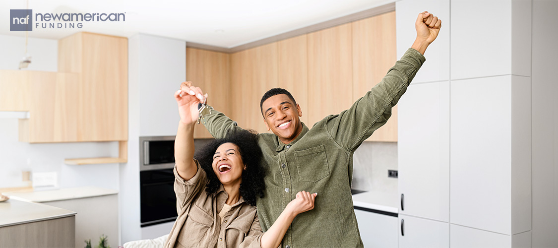 First-time buyers rejoicing after purchasing their first home
