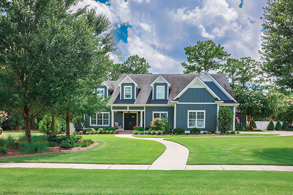 couple in front of their home