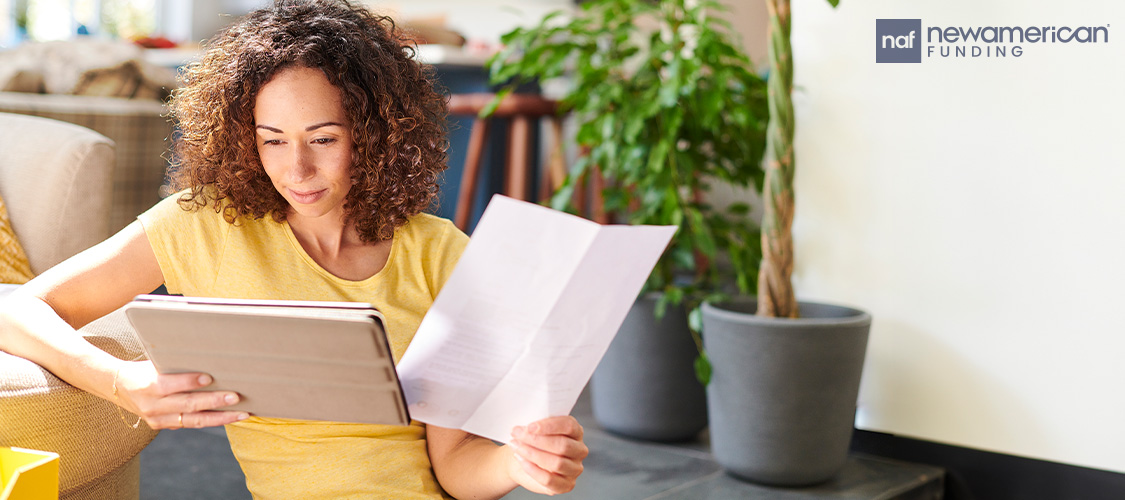 A woman looking at paperwork.