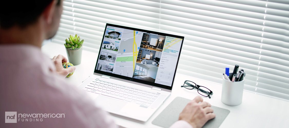 Someone looking at home listings online.