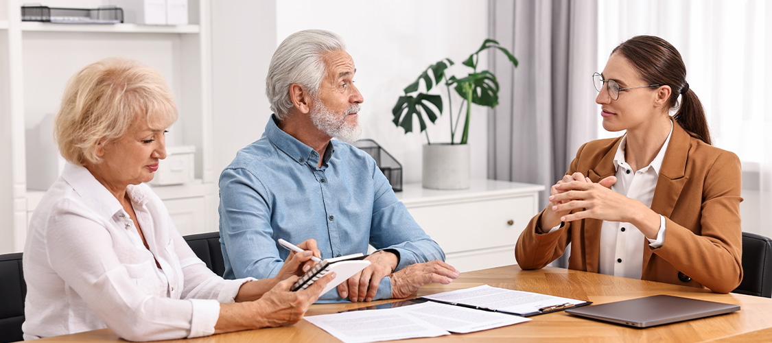Older homeowners meeting with an accountant or doing their taxes