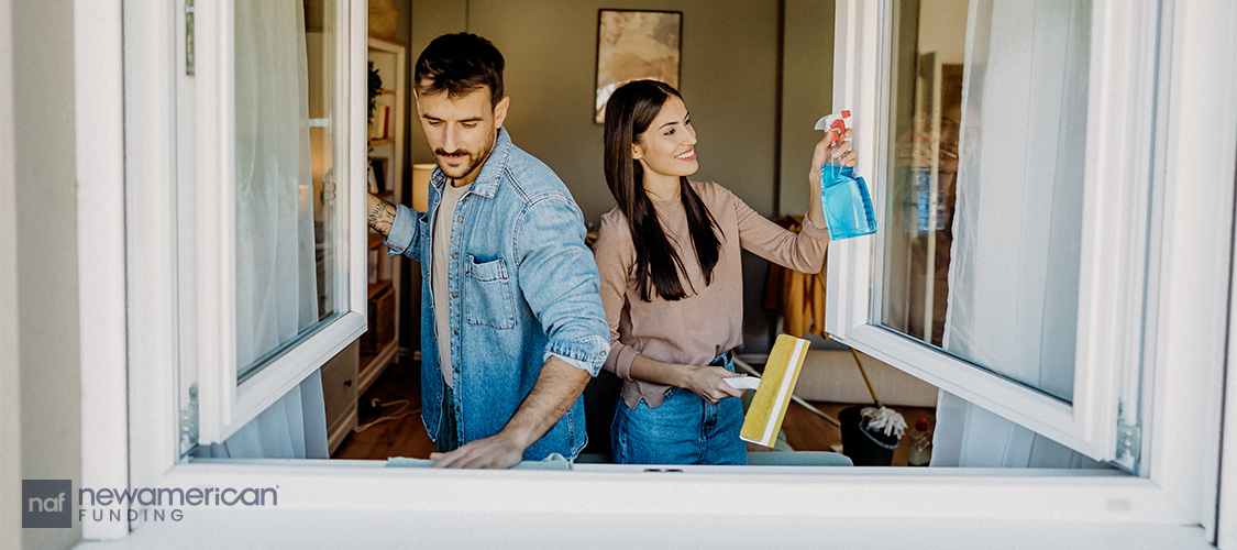 A couple cleaning windows.