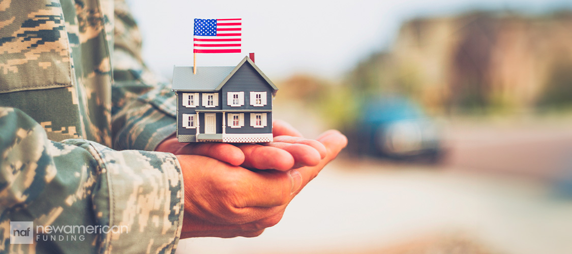 A veteran holding a house
