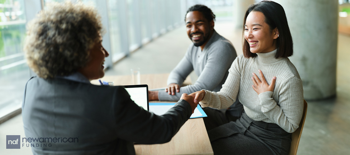 A couple meeting with a loan officer.