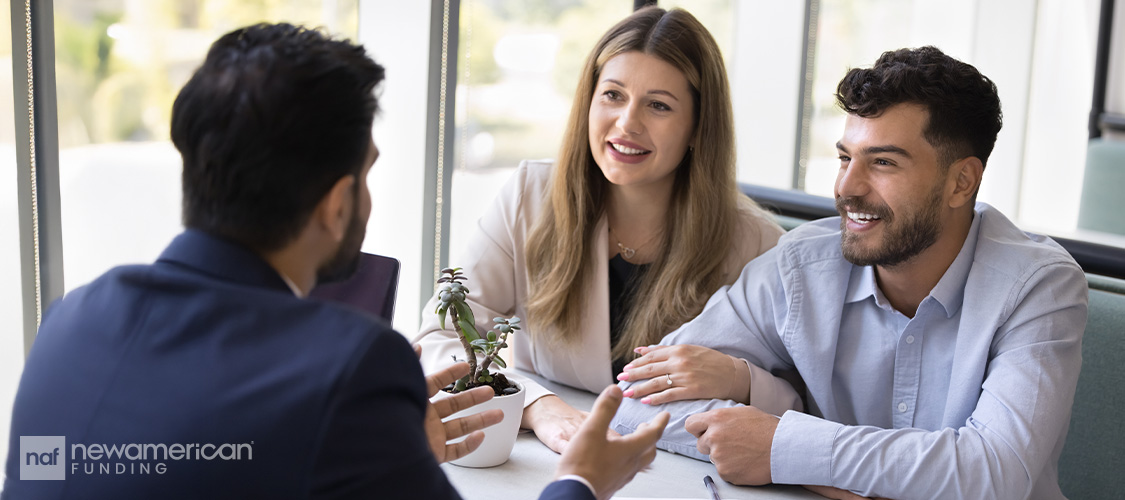 A couple meeting with a loan officer.
