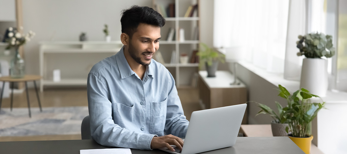 Man sitting at a laptop