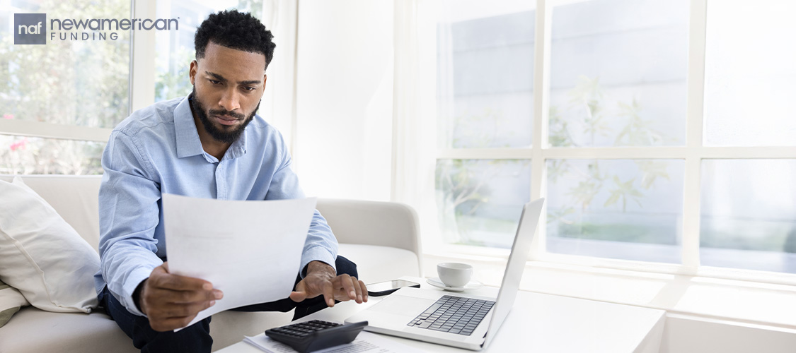 A man reviewing financial documents